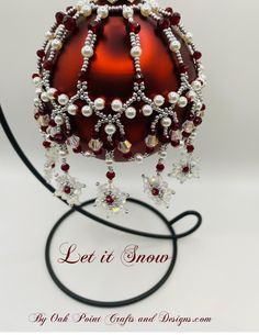 a red and white beaded christmas ornament