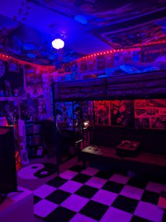 a room with black and white checkered flooring, purple lights and posters on the walls