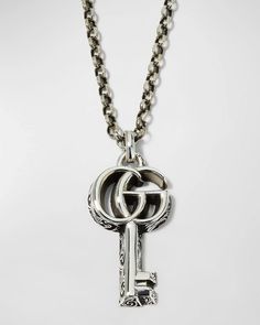 Elevate your Instagram style with this timeless Gucci double-G key pendant necklace. Crafted from sterling silver hardware with lustrous black onyx gemstone, showcase your personal design sensibilities for just the right touch of sophistication. At just under 20 inches in length, the subtle yet distinctive logo key effortlessly complements a variety of necklines. Cared for with a soft cloth, this heritage-inspired pendant makes the perfect addition to your daily looks or special occasions for its enduring luxurious charm. Silver Key Necklace, Key Charm Necklace, Key Pendant Necklace, Gucci Jewelry, Gucci Gg Marmont, Charm Necklace Silver, Key Necklace, Gg Marmont, Flower Pendant Necklace