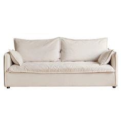 a white couch with two pillows on it