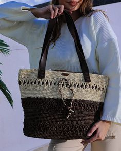 Brown straw bag - perfect for all your summer adventures! 🏖️🌞 Handcrafted with care and excellence, this oversized Beach Bag is your new must-have accessory to carry all your essentials in style.   Our summer tote bag is crafted from high-quality paper yarn, ensuring it's both durable and eco-friendly. With its elegant crochet pattern, this raffia bag is the perfect combination of fashion and function, making it one of the best beach bags on the market today! 🌿👜 🛍️ Large shoulder bag - Designed with a comfortable and sturdy strap, this bag is easy to carry over the shoulder, providing hands-free convenience while shopping, strolling along the beach, or exploring local markets during your vacation.  🔒 Zipper beach bag - The zip-top closure ensures your belongings are safely secured, s Eco-friendly Brown Shoulder Bag For Vacation, Beach Hobo Bag With Braided Handles, Hobo Bag With Adjustable Strap For Beach Season, Beach Season Hobo Bag With Adjustable Strap, Bohemian Hobo Bag With Braided Handles For Vacation, Eco-friendly Hobo Bag With Adjustable Strap For Vacation, Adjustable Strap Hobo Bag For Everyday Beach Use, Travel Shoulder Pouch Bag With Braided Handles, Travel Pouch Shoulder Bag With Braided Handles