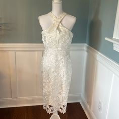 This Beautiful White Lace Is Fully Lined. Dress Is Sleeveless And Never Worn. Runs Little Small. Wear This For A Wedding Or Anniversary. Wear It For A Cruise!! 40 Inches From Top Of Back To Hem. Non Smoking Home. No Pets. Just A Lovely Dress!!! Elegant Sleeveless Lace Dress For Date Night, Fitted Sleeveless Halter Dress For Brunch, Elegant Lace Sleeveless Dress For Cocktail, Fitted Sleeveless Halter Wedding Dress, Elegant Sleeveless Lace Dress, Chic Sleeveless Lace Dress For Formal Occasions, Feminine Fitted White Halter Dress, Elegant Sleeveless Lace Dress For Formal Occasions, Elegant Formal Sleeveless Lace Dress