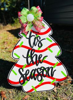 a christmas tree sign with the words tis the season on it