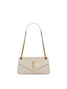 The Calypso Shoulder Bag by Saint Laurent is decorated with the brand's Cassandre logo, featuring a leather and chain crossbody strap that can be worn doubled for shoulder carry. Cream Ysl Bag, Lv Shoulder Bag, Anthony Vaccarello, Slingback Pump, Crossbody Strap, Ysl Bag, Yves Saint Laurent, Saint Laurent, Pumps