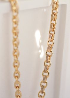 Our 18K Gold Plated Pave Chain Link Necklace exudes luxury and grace with a modern twist. Designed for everyday wear and special occasions, each chain link reflects timeless elegance. The pave CZ diamonds add the perfect touch of sparkle without being too flashy. This necklace is a statement of sophistication, perfect for any occasion. Expertly crafted with polished 18K gold, it will shine for years to come. Details: Material: Premium 18K gold complemented by cubic zirconia pave. Length: A perfe Luxury Gold Cartier Necklaces, Luxury Elegant Rectangular Link Chain Necklace, Luxury Paperclip Chain Necklace For Women, Luxury Classic Jewelry With Paperclip Chain, Luxury Necklace With 17 Jewels And Rectangular Pendant, Luxury Diamond Necklace With Gold Chain, Luxury Cable Chain Necklaces For Anniversary, Luxury Gold-plated Rectangular Jewelry, Luxury Classic Rectangular Chain Necklace