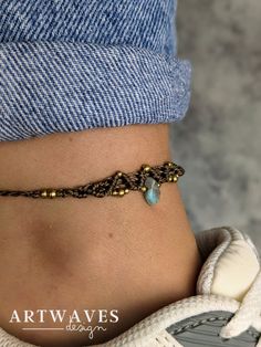 a close up of a person's stomach wearing a bracelet