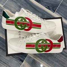 Husband Needs A Us 10.5 And They Are Sold Out!!! My Loss Your Gain. The Gucci New Ace Playfully Modernizes The Traditional Athleisure Sneaker With Interlocking Gg And Athletic Stripes. The Fashion House's Signature Green And Red Color Combo Recalls Heritage Themes Set Against An All-White Silhouette. A Solid Rubber Heel Makes This Low-Top A Lasting Wardrobe Addition. Gucci Custom Sneakers With Rubber Sole For Streetwear, Gucci Sneakers With Logo Detail For Sports, Gucci Low-top Custom Sneakers For Streetwear, Gucci Leather Sneakers With Logo, White Gucci Sneakers With Logo, White Sneakers With Signature Stripes For Streetwear, Gucci Custom White Sneakers With Branded Heel, Gucci Green Sneakers With Rubber Sole, Gucci Custom Lace-up Sneakers With Embroidered Logo