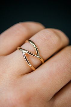 This beautiful 14kt gold-fill wrapped ring will become a staple in your wardrobe. This ring is handcrafted out of a D-shaped (half round) metal. Two ends connect at the center of the ring create a branch-like design. This ring is whimsical, classic and infinitely stylish. Please note, this listing if for ONE single ring in 14K Gold-fill. + Available In Silver (sold separately): https://www.etsy.com/listing/240271360/silver-branch-ring-sterling-silver + View More Stacking Rings: https://www.etsy. Gold Wrap Ring, Gold Stacking Ring, Criss Cross Ring, Minimal Ring, Branch Ring, Single Ring, Bold Rings, Gold Wrap, Symbolic Jewelry