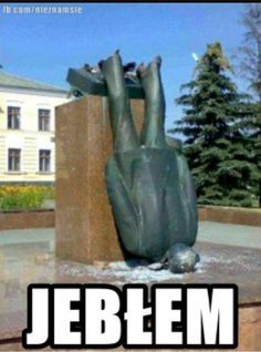 there is a statue in front of a building with the words jebem on it