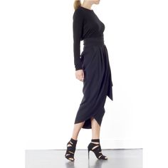 The Blake Tulip skirt is super flattering on any size. Coming in one size fits all, this wrap-around tulip style is designed to sit high on the waist. It's finished with a wrap-around belt that ties at the side, to nip in your waist for a flattering effect. Tie into a bow or leave as it is. This dramatic outline is best complemented with a fitted top. Hand wash recommended Wash with like colours to avoid colour transfer Press on reverse side Iron on low heat  100% polyester Plum Midi Dress, Black Tulips, Tulip Skirt, Fitted Top, Red Top, Independent Designers Fashion, Wrap Skirt, Badger, Price Match