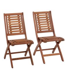 two wooden chairs sitting next to each other