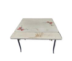 an old table with flowers painted on it