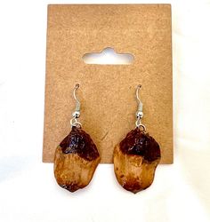 "Real pinecone earrings made with pinecone petal preserved in resin on nickel-free French hooks. Pinecone petal is approximately 1\" tall and 0.75\" wide, but exact size, shape, and color will vary -- all are real pinecone petals from local Rocky Mountain evergreen pines! Resin coating adds shine and structure while preserving the petal for years to come." Pinecone Earrings, Free In French, Resin Coating, Lovely Earrings, Rocky Mountain, Pine Cones, Rocky Mountains, Jewelry Ideas, Jewelry Earrings Dangle