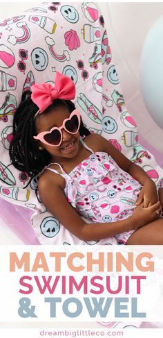 girl laying down on a beach towel that's light pink with blue smiley faces, surfboards, rainbows and hot pink sunglasses on it. She's wearing a matching one piece swimsuit in the same print and has pink heart sunglasses on. Playful Sleeveless Swimwear For Vacation, Playful Spring Tankini With Uv Protection, Playful Swimwear With Uv Protection For Sunbathing, Playful Swimwear With Adjustable Straps For Summer, Printed Summer Swimwear With Spaghetti Straps, Printed Spaghetti Strap Swimwear For Summer, Playful Swimwear For Spring Beach Party, Playful Pink Swimwear For Poolside, Playful Adjustable Swimwear