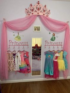 there is a princess closet with dresses hanging on the wall