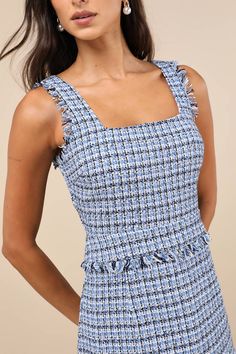 It's easy to become a style icon with pieces like the Lulus Adorably Luxurious Blue Tweed Raw Edge Sleeveless Mini Dress! Woven tweed fabric, with a blue, white, and black design throughout, shapes tank straps and a flattering square neckline. Darted bodice continues down to a fitted waist, atop a lightly flaring skirt with a flounce-trimmed mini hem. Raw-edge trim at the arms and waist completes the look. Hidden zipper/clasp at back. Fit: This garment fits true to size. Length: Mid-thigh. Size White And Black Design, Tier Dress, Tiered Ruffle Dress, Blue Tweed, Adhesive Bra, Tweed Fabric, Blue White And Black, Sleeveless Mini Dress, Strapless Bra