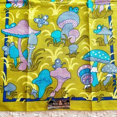 the yellow and blue fabric has mushrooms on it