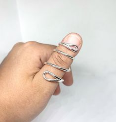 "This beautiful Sterling Silver splint will help correct trigger finger, providing with the needed support that'll give your joint time to heal. ♥ IF YOU HAVE QUESTIONS ABOUT SIZING PLEASE KEEP READING ♥ This Sterling Silver Spiral Splint Ring will help you feel some comfort while wearing a beautiful piece made with love. We make jewelry with soul, at affordable prices, we want our pieces to help you in any way they can, and of course, that you love the way they look on you. This ring will let y Adjustable Spiral Promise Rings, Adjustable Spiral Hand Wrapped Rings, Adjustable Spiral Rings With A Modern Twist, Adjustable Spiral Ring With A Modern Twist, Adjustable Spiral Ring With Modern Twist, Adjustable Spiral Stackable Rings, Thumb Splint, Finger Splint, Time To Heal