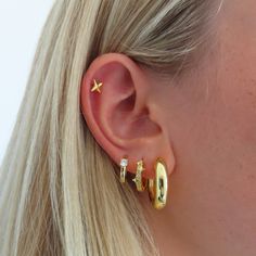 Feel like you hit the jackpot with the Celeste Earrings! These lightweight X studs are perfect for any day of the week. Keep it simple and stylish with these beauties. Trendy Pierced Huggie Earrings, Trendy Tarnish Resistant Cartilage Earrings, Trendy Tarnish-resistant Cartilage Earrings, Trendy Tarnish-resistant Everyday Piercings, Trendy Gold Ear Wire Piercings, Trendy Everyday Pierced Wrap Earrings, Trendy Pierced Ear Cuff For Everyday, Trendy Gold Piercings With Matching Earrings, Trendy Everyday Ear Climbers