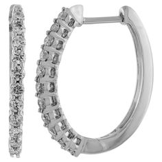 Nothing says luxury like an incredible pair of diamond oval hoop earrings. These stunning brightly polished 14 karat white gold outside oval-shaped hoop earrings feature a total of 24 round brilliant cut diamonds totaling 1.00 carats are prong set on the outside front creating a dose of incredible scintillation and fire. These are I-J color and I1/I2 clarity. Hinges on the bottom and click top posts secure these glamorous hoop earrings that are perfect for any occasion. Oval Hoop Earrings, Surgical Steel Earrings, Jewelry Earrings Hoops, Oval Diamond, Round Brilliant Cut Diamond, Round Brilliant, Prong Setting, Diamond Bracelet, Gold Diamond