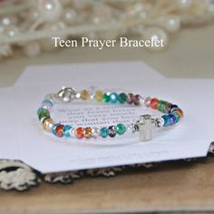 Teen girl bracelet in multi-colored crystal beadsTeen bracelet with prayerSilver cross Clasp closure Teen Prayer: Wear as a reminder that Jesus loves you very much. I pray that you become the woman that God wants you to be. Proverbs 31:10Gift boxMade in the USA Coolest Crafts, Wwjd Bracelet, Prayer Jewelry, Faith Bracelet, Girl Bracelet, Prayer Bracelet, Holiday Planner, Love You Very Much, Proverbs 31