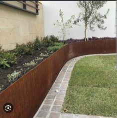 an outdoor garden area with grass and plants