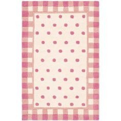 a pink and white checkered area rug with polka dots on the border, in front of a white background