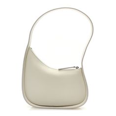 This is an authentic THE ROW Smooth Calfskin Half Moon Shoulder Bag in Ivory. This chic shoulder bag is crafted of luxuriously white calfskin leather. The bag features a shoulder strap and a silver zipper. The top zipper opens to a beige suede interior. White Chic Baguette Bag With Single Shoulder Strap, Chic White Baguette Bag With Single Shoulder Strap, Modern White Hobo Bag For Evening, Luxury Cream Baguette Bag For Evening, Luxury Cream Baguette Bag For Formal Occasions, Elegant White Soft Leather Shoulder Bag, Elegant White Hobo Bag, White Classic Hobo Shoulder Bag, Classic White Hobo Shoulder Bag