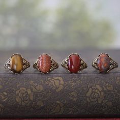 14 x 10mm cabochon on an antiqued sterling silver plated or brass adjustable ring.  Easy to adjust to any size. Choose from Tigereye, Goldstone, Carnelian or Leopardskin Jasper. Jasper Aesthetic, Leopardskin Jasper, Jasper Ring, Cameo Ring, Snowflake Obsidian, Vintage Style Jewellery, Leather Chokers, Filigree Ring, Adjustable Ring