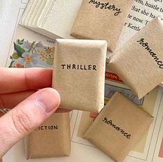 a person is holding some kind of book with words written on it and the word's title