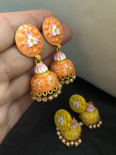 Very stylish and vibrant colors meena work jhumka earrings. Stunningly made designs with all the love and hand painted meena kari, perfect match for a perfect outfit! Grab all the lovely new arrivals we have! Colors : yellow, orange In stock and ready to wear. Enamel Earrings For Wedding, Temple Jewelry Meenakari Drop Jhumkas, Handmade Chandbali Earrings For Gift, Handmade Chandbali Earrings As Gift, Meenakari Enamel Jewelry, Gift Jhumkas With Cutdana For Festivals, Bohemian Meenakari Chandbalis Drop Earrings, Bohemian Chandbalis With Meenakari In Drop Shape, Traditional Hand Painted Drop Earrings