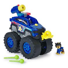 a toy truck with a dog next to it