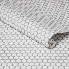 an image of a white and grey wallpaper with circles patterning it's surface