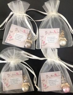 three bags filled with different types of ornaments in organ bags on top of a table