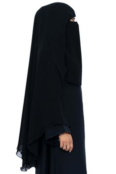 Simple and elegant is how we describe our Muhessa Niqab. Made with 2 layers of soft chiffon and draping a full 45 inches, Muhessa is designed for modesty and simplicity. Free from stones and embellishments, Muhessa is your choice for creating a look of piety and modesty. Pair Muhessa with your favorite Classic Black abaya for a classy, understated look. Made with luxuriously soft chiffon Long Niqab 45" inches Plain niqab without stones Abaya not included Made in Dubai Black Abaya, Garment Workers, Niqab, In Dubai, Classic Black, Double Layer, Dubai, Embellishments, Chiffon