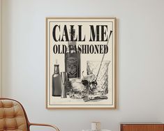 an old fashioned advertisement hangs on the wall next to a chair and side table in a living room