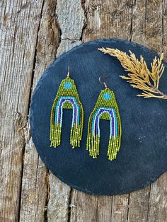 Olive green beaded earrings, rainbow fringe earrings, Long beaded Earrings, Bead Fringe earrings, Ombre earrings, Wave earrings ♥𝑇ℎ𝑒 𝑝𝑎𝑡𝑡𝑒𝑟𝑛 𝑜𝑓 𝑡ℎ𝑖𝑠 𝑒𝑎𝑟𝑟𝑖𝑛𝑔 𝑖𝑠 𝑐𝑟𝑒𝑎𝑡𝑒𝑑 𝑏𝑦 𝐻𝑊𝐵𝑒𝑎𝑑𝐽𝑒𝑤𝑒𝑙𝑟𝑦. ♥𝑀𝑎𝑑𝑒 𝑢𝑠𝑖𝑛𝑔 𝑓𝑟𝑒𝑒ℎ𝑎𝑛𝑑 𝑏𝑒𝑎𝑑𝑖𝑛𝑔 𝑤𝑜𝑣𝑒𝑛 𝑡𝑒𝑐ℎ𝑛𝑖𝑞𝑢𝑒𝑠 𝑤𝑖𝑡ℎ 𝑠𝑡𝑟𝑜𝑛𝑔 𝑠𝑦𝑛𝑡ℎ𝑒𝑡𝑖𝑐 𝑡ℎ𝑟𝑒𝑎𝑑. ♥𝑇ℎ𝑒 𝑠𝑖𝑧𝑒 𝑜𝑓 𝑡ℎ𝑒 𝑠𝑒𝑒𝑑 𝑏𝑒𝑎𝑑𝑠 𝑢𝑠𝑒𝑑 𝑖𝑠 2 𝑚𝑖𝑙𝑙𝑖𝑚𝑒𝑡𝑒𝑟𝑠 𝑎𝑛𝑑 𝑏𝑒𝑎𝑑𝑠 𝑎𝑟𝑒 ℎ𝑖𝑔ℎ 𝑞𝑢𝑎𝑙𝑖𝑓𝑖𝑒 Rainbow Beaded Fringe Earrings For Gift, Green Bohemian Beaded Earrings With Tiny Beads, Bohemian Green Chandelier Earrings With Colorful Beads, Green Bohemian Chandelier Earrings With Colorful Beads, Green Teardrop Beaded Earrings With Dangling Beads, Bohemian Green Beaded Earrings With Colorful Beads, Green Teardrop Earrings With Tiny Beads, Green Bohemian Beaded Earrings, Bohemian Green Beaded Earrings