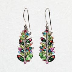 Decked with delightful colors and unique designs, these jolly earrings are sure to brighten up your holiday wardrobe. The Firefly Mosaic Christmas Tree Earrings are sure to make your holiday season feel merry and bright. One of the best features about these earrings, other than their captivating collection of colors, is that you can wear them year round! This makes them a must-have gift idea for the earring wearer in your life. The fun color combo is a splendid take on the traditional centerpiece of the season. All eyes are sure to be on you when wearing these festive finds to all the holiday gatherings. Multi-color European crystals, Czech glass Approximately 1.5 inches long, pendant 1 inch long and 0.5 inch in diameter Sterling silver ear wires; setting is silver-plated antiqued steel Do Whimsical Earrings As A Gift, Holiday Green Drop Earrings, Whimsical Colorful Earrings For Gifts, Green Holiday Drop Earrings, Colorful Whimsical Earrings For Gifts, Whimsical Multicolor Earrings For Gift, Whimsical Multicolor Earrings As Gift, Holiday Multicolor Earrings As A Gift, Holiday Multicolor Earrings Perfect For Gifts