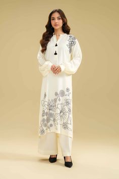 Brand: NishatCollection: Nishat Any Day Winter Unstitched CollectionFabric: Karandi DESIGN DETAILS: SHIRTSolid Premium Karandi Shirt: 3 MeterEmbroidered Front + MotifsFabric: KarandiColor: Off White TROUSERSSolid Premium Karandi Trousers: 2.5 MeterFabric: KarandiColor: Off White DISCLAIMER:* Lining, Laces, and Tassels are not included in unstitched variants.* Embellishment items in stitched outfits are subject to market availability.* The actual colors of the outfit may vary from the colors being displayed on your device. CARE INSTRUCTIONS: Extra Fabric Has Been Used For Shoot Original Color May Vary Slightly From The Picture Dry Clean Recommended Iron The Clothes At Moderate Temperature Do Not Use Bleach, Or Stain Removing Chemicals Damp Fabric Should Not Be Exposed To Sunlight Nishat Any White Unstitched Suit With Floral Embroidery And Long Sleeves, Eid Special Embroidered Palazzo Set, Eid Festival Long Sleeve Embroidered Palazzo Set, Semi-stitched Floral Embroidery Set With Long Sleeves, Semi-stitched Long Sleeve Sets With Floral Embroidery, Elegant White Cambric Palazzo Set, Elegant Floral Embroidered Cambric Sets, Embroidered Unstitched Cream Suit With Long Sleeves, Embroidered Cream Unstitched Suit With Long Sleeves