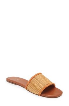 A woven raffia vamp enhances the sunny-day appeal of a minimalist slide sandal lined in soft leather and grounded by a slim rubber sole. Synthetic and textile upper/leather lining/rubber sole Imported Hispanic & Latinx Owned/Founded Casual Natural Slides With Woven Sole, Vacation Slides With Woven Straw Sole, Beach Sandals With Textured Straw Sole, Woven Straw Slides For The Beach, Woven Straw Slides For Beach, Beach Woven Straw Slides, Woven Straw Open Toe Slides, Natural Textured Sole Sandals For Summer, Beach Slides With Woven Sole And Open Toe