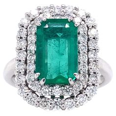 A spectacular, octagon-cut emerald weighing 6.1 carats is surrounded by two rows of diamonds rated G VS and weighing 1.04 carats and is set in beautiful 18-karat white gold for this magnificent ring. This cocktail ring was hand-made using traditional methods, this singular piece has been designed and produced in Palermo, Sicily, by master jewellers. The setting is 1.5 cm wide and 2 cm long, and it weighs 6.6 grams. The ring is 7 US/14 EU size and can be customized to a new size on request. Custo 1st Dibs, Palermo Sicily, Emerald And Diamond Ring, Emerald Diamond Ring, White Gold Set, Gold Piece, Signature Collection, Emerald Diamond, Gold Set