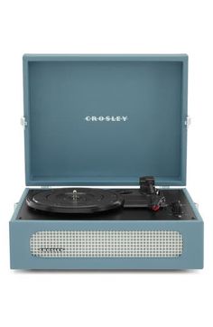 the crosley record player is in its blue case