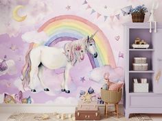 a child's room with a unicorn mural on the wall