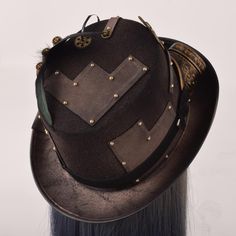 Put the perfect finishing touch on your outfit with the Victorian Steampunk Hats. Steampunk hat par excellence, this magnificent piece will bring to your outfit a refinement and an indescribable class. Its many small details such as the 3 potion vials will make you a true steampunk inventor. A high quality hat. Be comfortable: enjoy high-quality materials For events: Steampunk, Gothic, Victorian ⚙️ Ultra-original hat: Vials of potions, goggles, cogs and feathers Vintage Steampunk Style: unique d Steampunk Brimmed Mini Hats For Costume Party, Fitted Punk Hats For Cosplay, Black Steampunk Hat For Alternative Fashion, Vintage Black Hat For Alternative Fashion, Vintage Black Hats For Alternative Fashion, Gothic Brimmed Hat For Alternative Fashion, Vintage Top Hat With High Crown For Cosplay, Vintage High Crown Costume Hats For Cosplay, Steampunk Brimmed Mini Hats For Cosplay