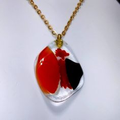 Gorgeous Handmade Free Form Pendant Alit With Fused Reds Blacks And White Suspended In Smooth Clear Glass. Comes With Lovely Gold Chain. Truly One Of A Kind Pendant: 2 Inches See Also Last Photo For Length... Red Round Pendant Necklace, Red Necklace With Large Round Pendant, Red Necklace With Large Pendant For Gifting, Red Necklace With Round Pendant, Unique Red Round Pendant Necklace, Unique Red Necklace With Large Pendant, Unique Red Necklace With Round Pendant, Red Necklace With Large Pendant For Formal Occasions, Unique Red Glass Necklace