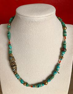 "Eclectic Turquoise Necklace w/ Beads from Nepal. Largest Bead 1.75\" Long. Natural Vintage Coral Inlaid Bead w/ Brass & Turquoise, very rare now a days. Also have an eclectic mix small natural coral with various sized brass beads. 18\" long. Upon Request I can custom make this necklace longer. I will quote a price and time required for this service. Returns only if item is received in original new condition. Buyer pays return shipping with insurance." Bohemian Rondelle Spacer Beads, Bohemian Rondelle Hand-strung Beads, Traditional Turquoise Oval Beads Jewelry, Turquoise Beaded Necklaces For Healing, Traditional Turquoise Beaded Necklaces With Spacer Beads, Adjustable Traditional Turquoise Necklace With Large Beads, Traditional Turquoise Beaded Necklace With Spacer Beads, Bohemian Turquoise Necklace With Colorful Heishi Beads, Bohemian Heishi Beaded Necklace With Polished Beads