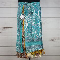 Nwt Darn Good Yarn Brand Recycled Sari Silk Wrap Skirt. Reclaimed Material From Used Saris. Tea Length (Approx. 34 In. Long). Dgy Size Goddess (Us Size 14-32). Reclaimed Material Means Flaws (Stains, Holes, Ink Errors, Thread Pulls, Etc.) Are Common And Expected! I List What I See, But May Miss Some. Silver Glitter Dots On Overskirt. Aqua Overskirt Slightly More Green, Less Blue In Person. Pinholes, Thread Pull, Thread Separations On Overskirt. Multiple Thread Pulls Throughout Underskirt. Blue Flowy Lined Wrap Skirt, Flowy Blue Wrap Skirt, Blue Tiered Lined Wrap Skirt, Blue Tiered Wrap Skirt For Spring, Blue Lined Midi Wrap Skirt, Blue Relaxed Midi Wrap Skirt, Blue Relaxed Fit Midi Wrap Skirt, Relaxed Fit Blue Midi Wrap Skirt, Casual Long Blue Wrap Skirt