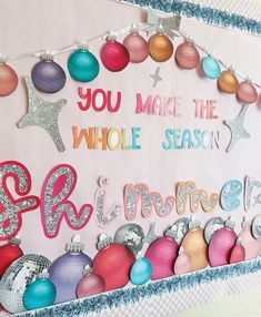 a bulletin board with ornaments and words on it that say you make the whole season