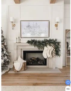 a living room decorated for christmas with stockings on the fireplace