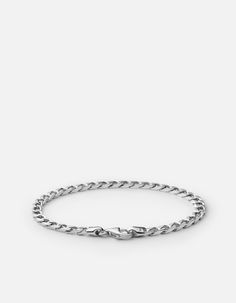 The men's 4mm Cuban Chain Bracelet is handcrafted from sterling silver. Wear alone or layer for an elevated yet modest accent to any look. Also available in gold vermeil. [tab]Specifications[/tab]Base Metal: Sterling SilverPlating: Polished RhodiumMaterial: Sterling Silver ChainDimensions: Medium: L: 7 1/2 inches, Large: L: 7 1/4 inches, Small: L: 6 1/2 inchesGauge: 4mm Model is wearing size medium. Cuban Chain Bracelet, Jewelry Staples, Men's Bracelets, Mens Bracelet Silver, Figaro Chain, Silver Chain Bracelet, Sterling Silver Mens, Classic Jewelry, Cuban Chain